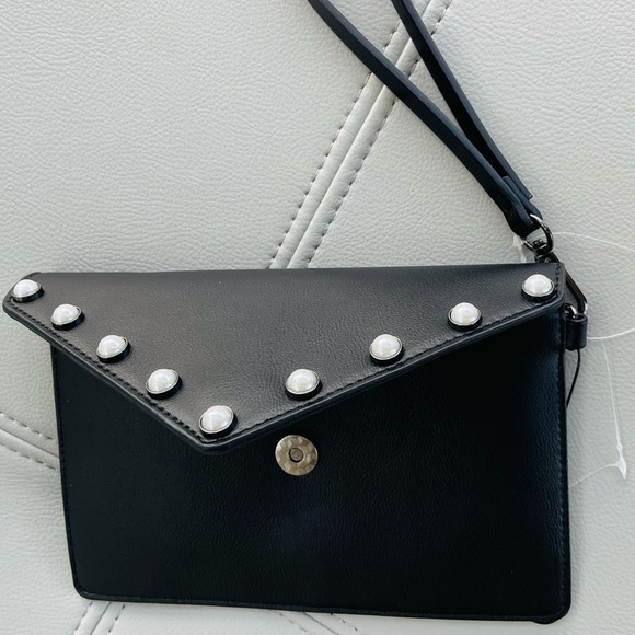 New With Tags
BCBG Pearl + Leather Inspired
Envelope Clutch in
BLACK - Picture 13 of 15